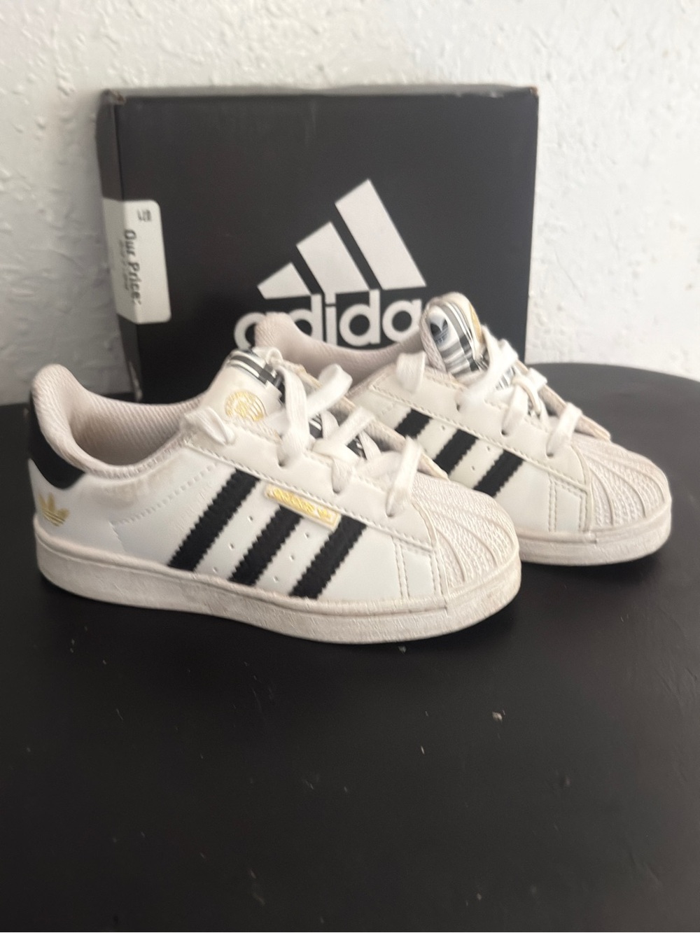 adidas Kids White Clam Shell Sneakers with Black Stripes and Gold Accents
